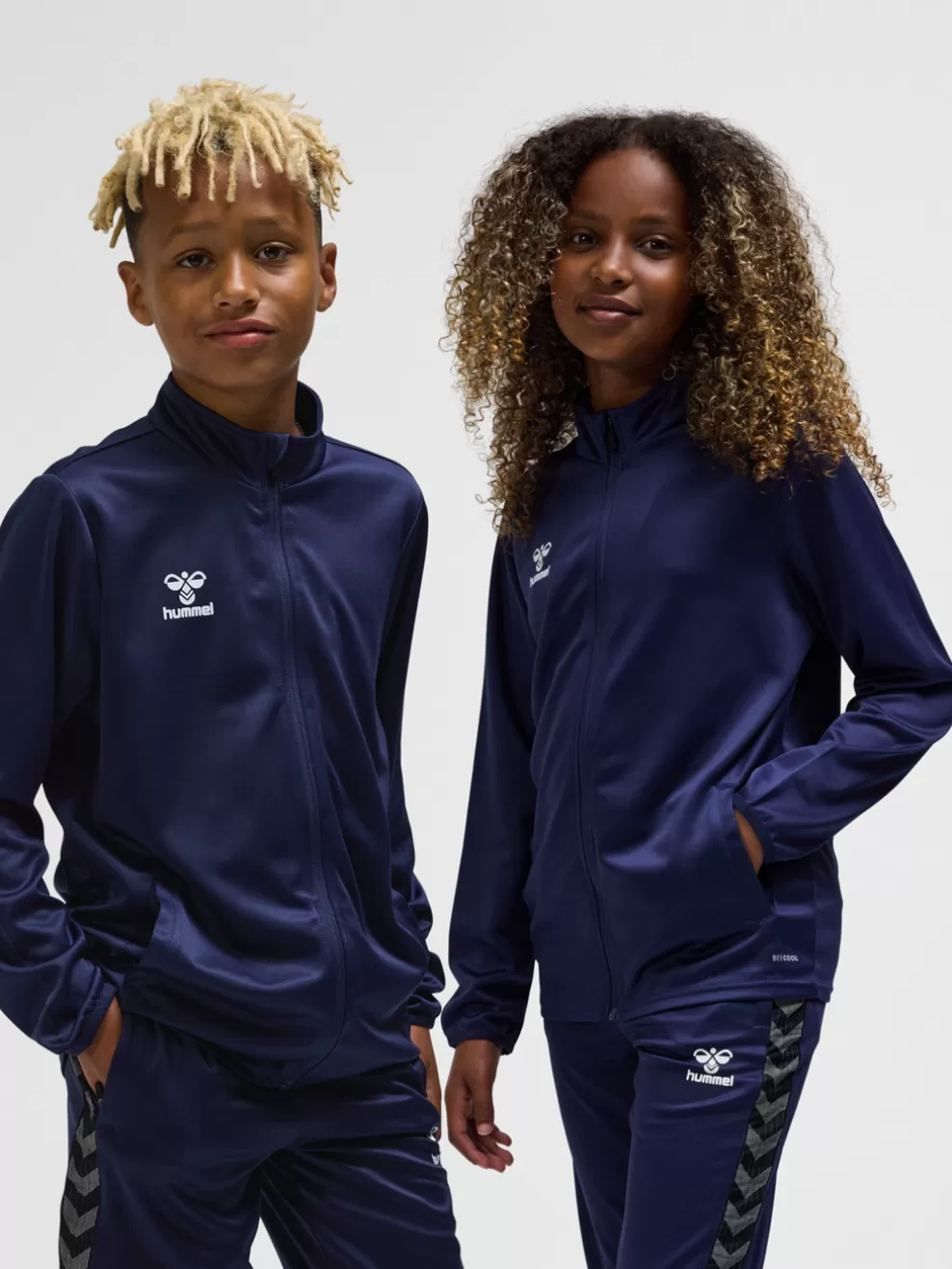 hmlESSENTIAL TRACK JACKET KIDS*hummel Hot